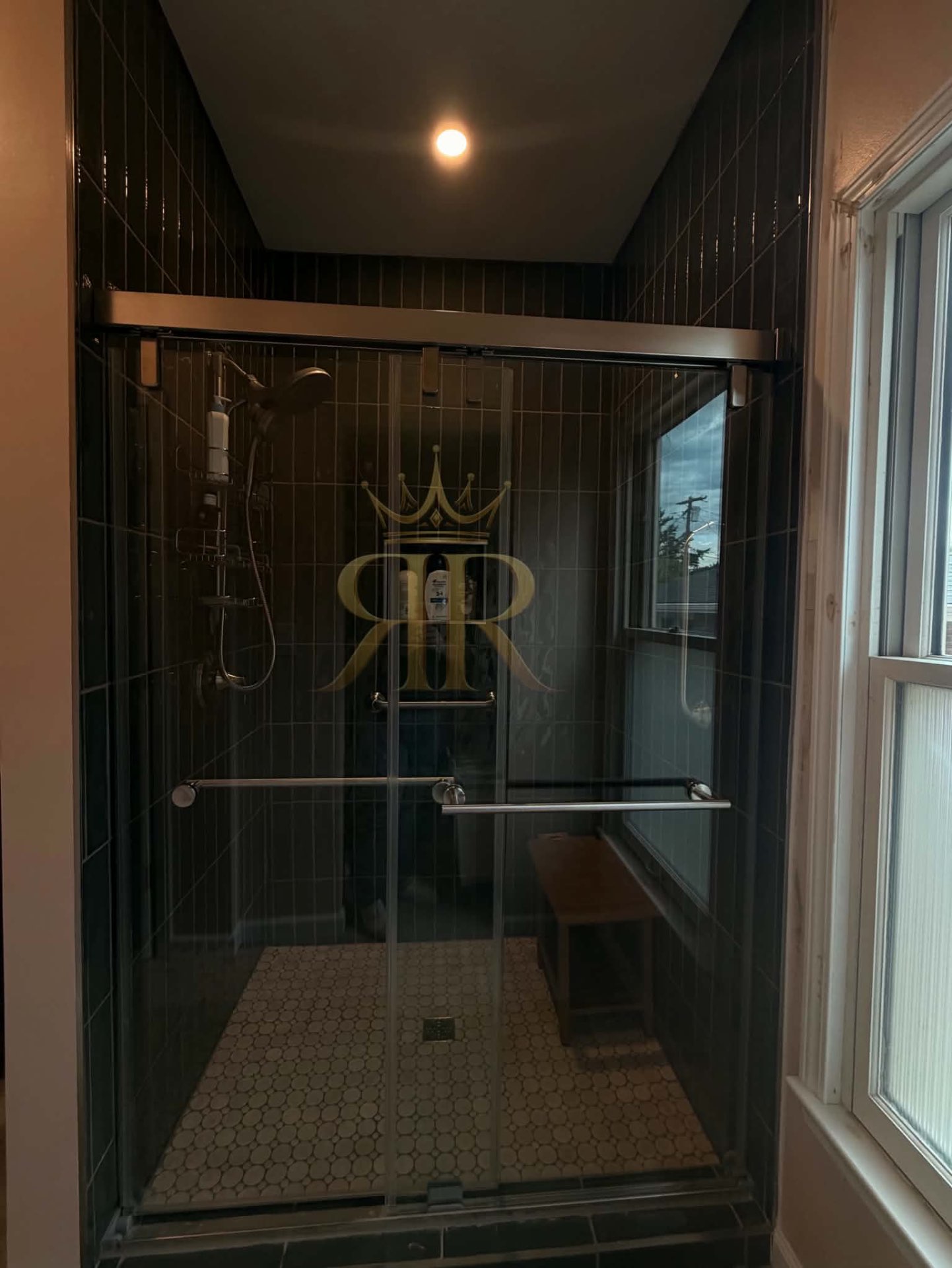Completed tiled walk-in shower with glass doors